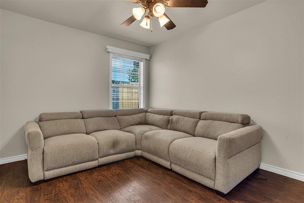 2309 Ranch House Drive Denton, TX 76210 - Photo 18 of 28 a living room with furniture and a large window