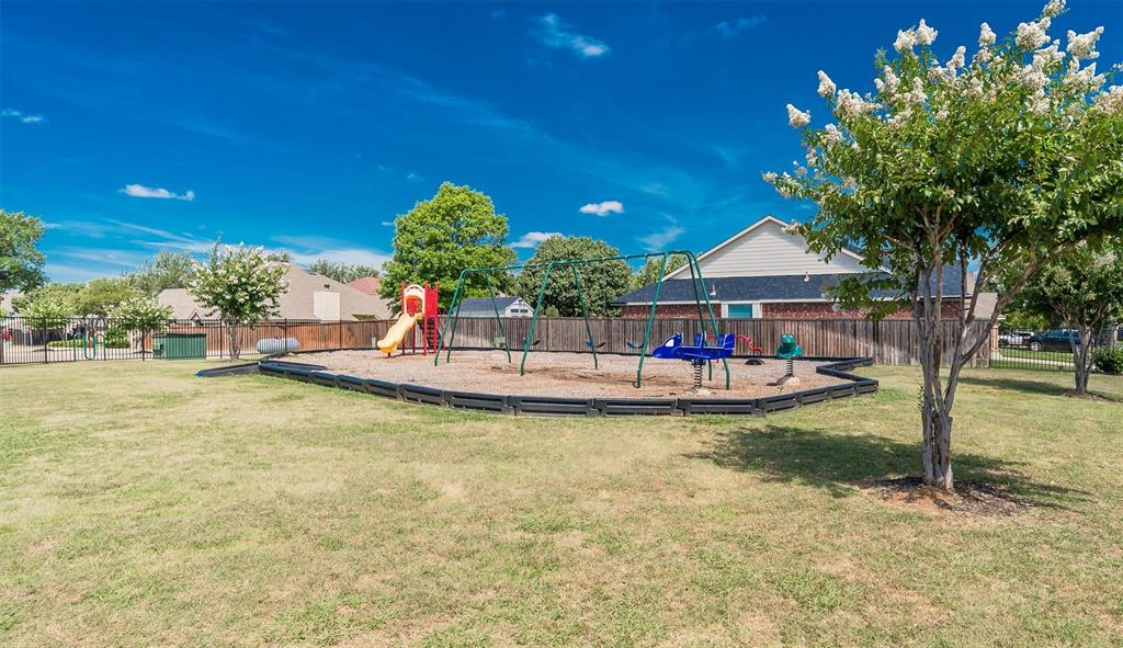 2309 Ranch House Drive Denton, TX 76210 - Photo 21 of 28 a view of a swimming pool with a patio