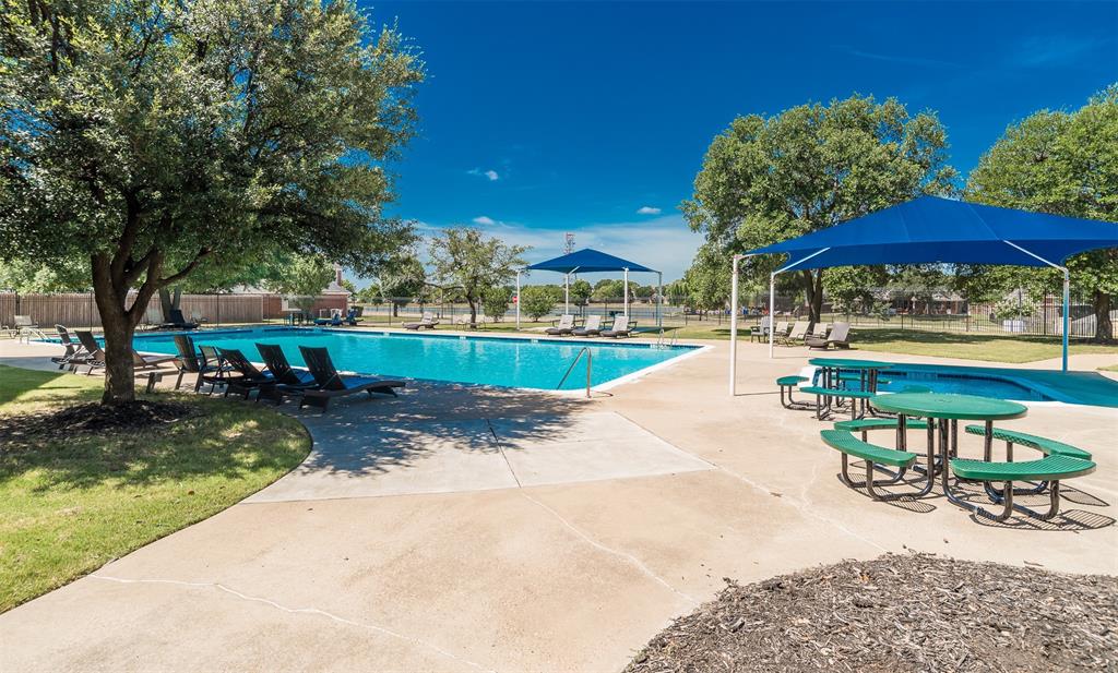 2309 Ranch House Drive Denton, TX 76210 - Photo 25 of 28 a view of a swimming pool with a patio and a yard