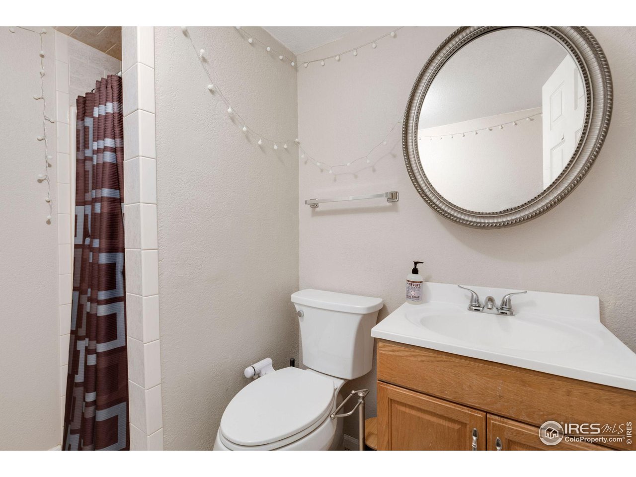 109 3rd Street Pierce, CO 80650 - Photo 16 of 21 a bathroom with a sink mirror vanity and toilet