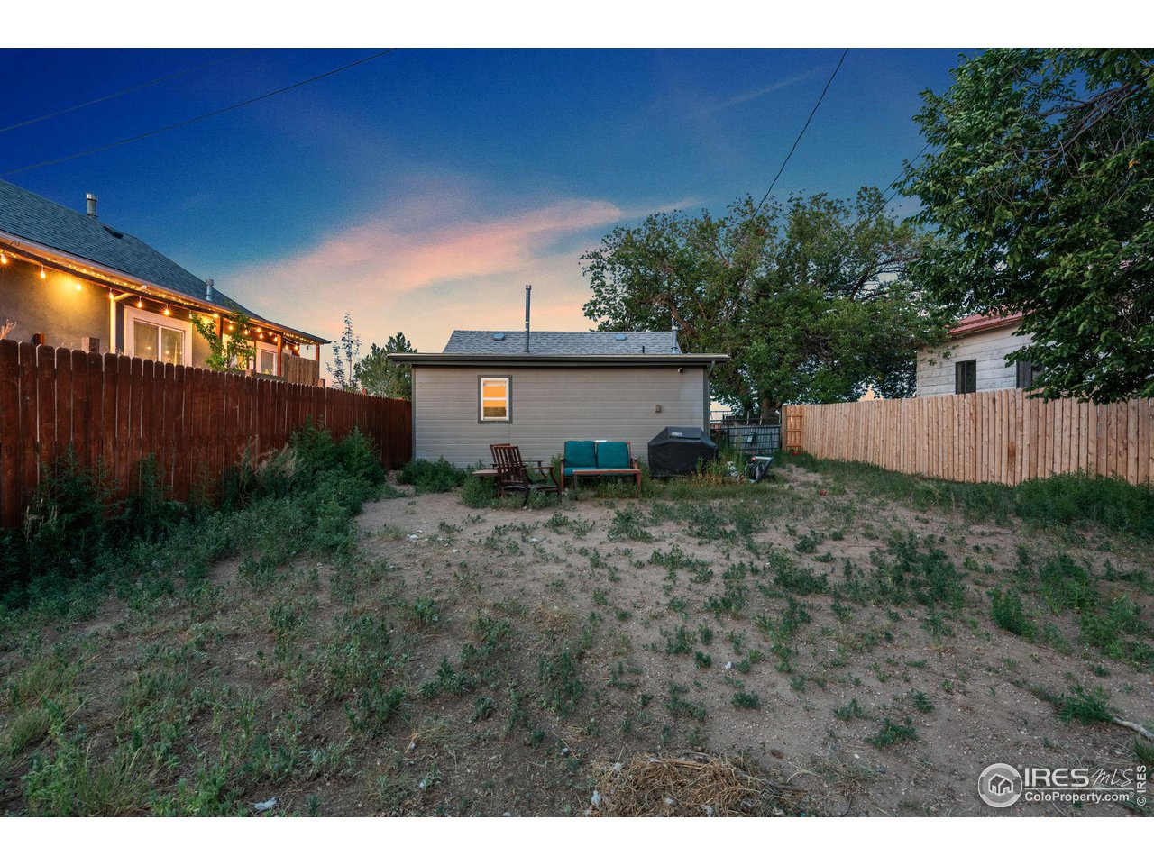 109 3rd Street Pierce, CO 80650 - Photo 18 of 21 a view of a house with backyard and garden
