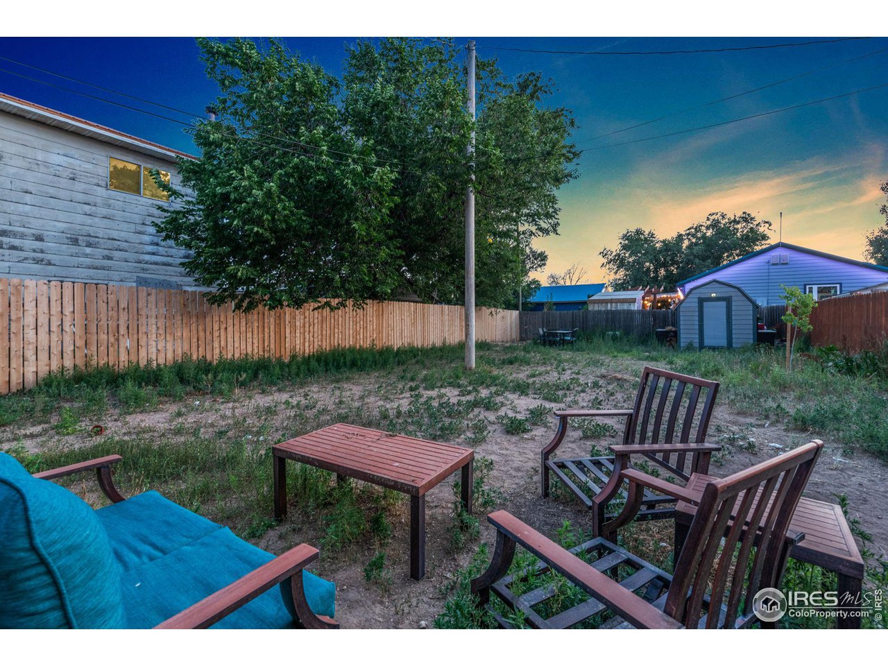 109 3rd Street Pierce, CO 80650 - Photo 19 of 21 a backyard of a house with table and chairs
