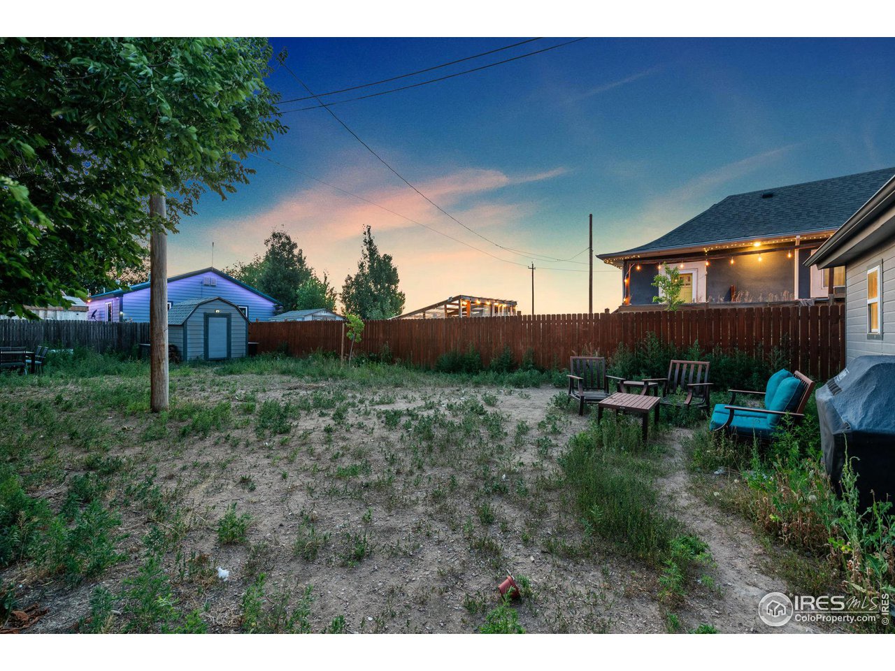 109 3rd Street Pierce, CO 80650 - Photo 20 of 21 a backyard of a house with table and chairs