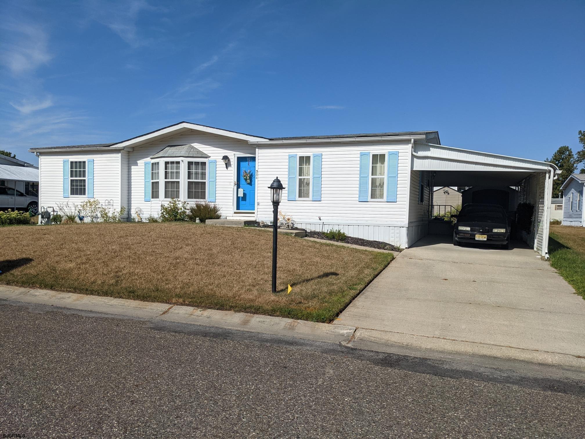 a front view of a house with yard