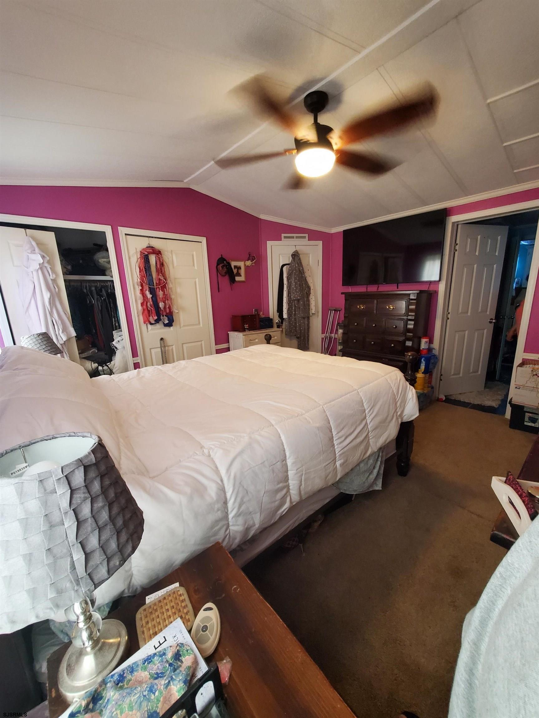 334 John Alden Drive Buena, NJ 08310 - Photo 11 of 27 a bedroom with a bed and a chandelier