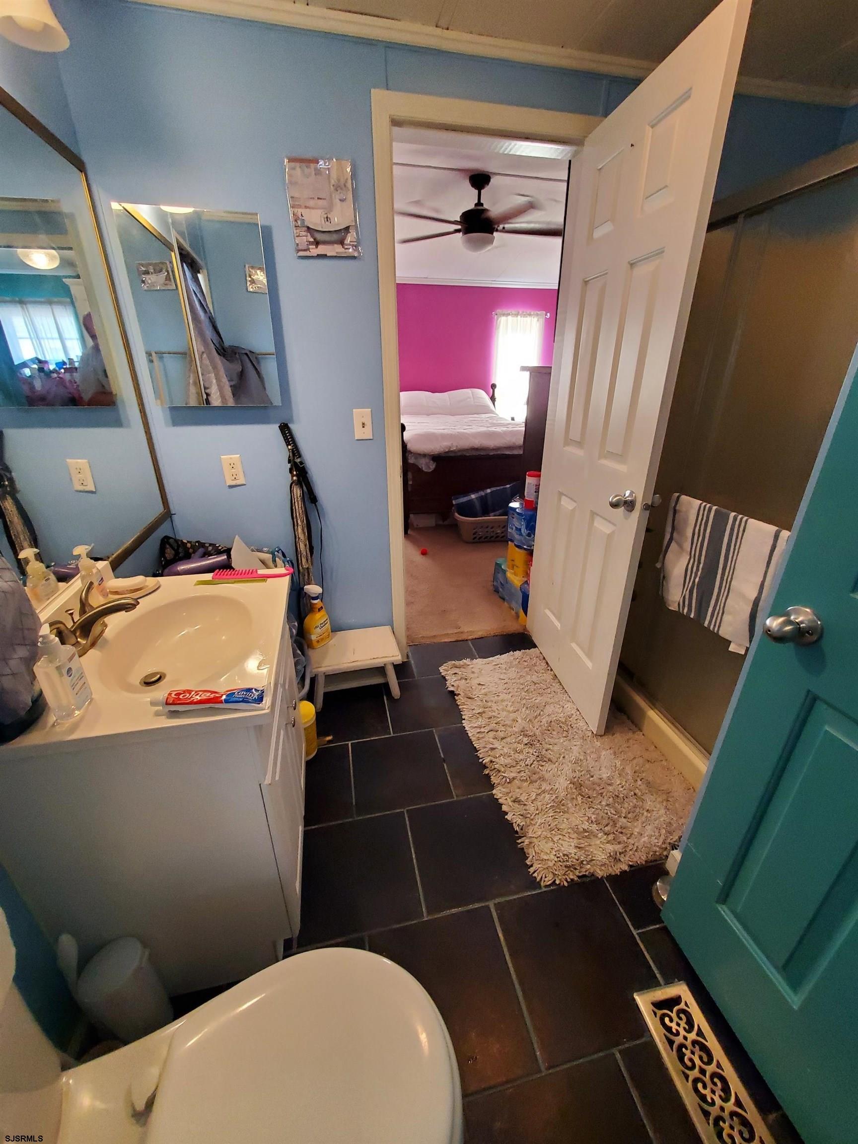 334 John Alden Drive Buena, NJ 08310 - Photo 12 of 27 a bathroom with a toilet a sink and a mirror