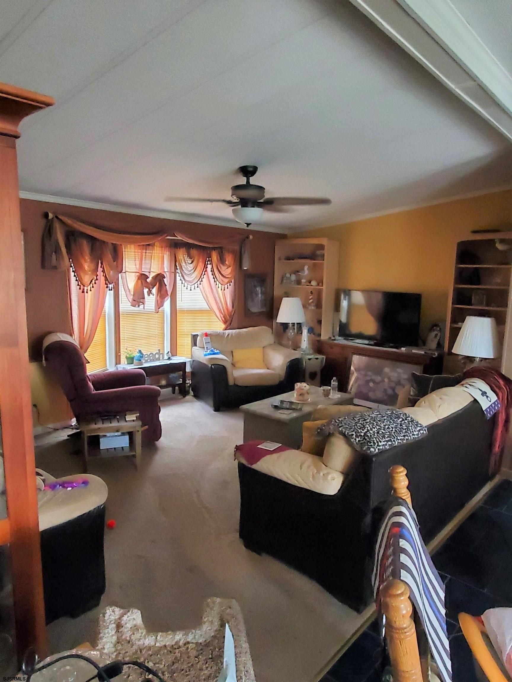 334 John Alden Drive Buena, NJ 08310 - Photo 2 of 27 a living room with furniture and a flat screen tv