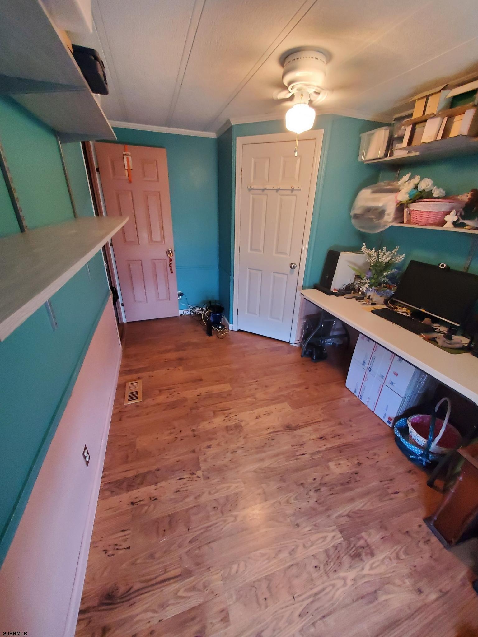 334 John Alden Drive Buena, NJ 08310 - Photo 22 of 27 a room with lots of different colored cloths