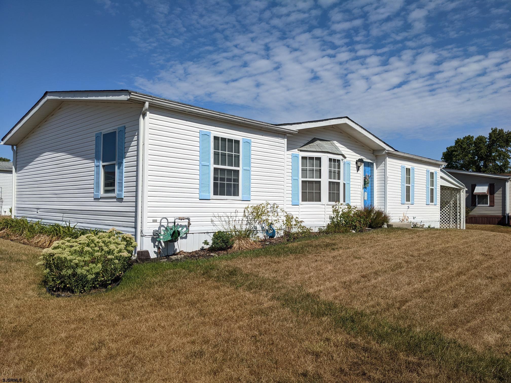 334 John Alden Drive Buena, NJ 08310 - Photo 24 of 27 a front view of a house with a yard