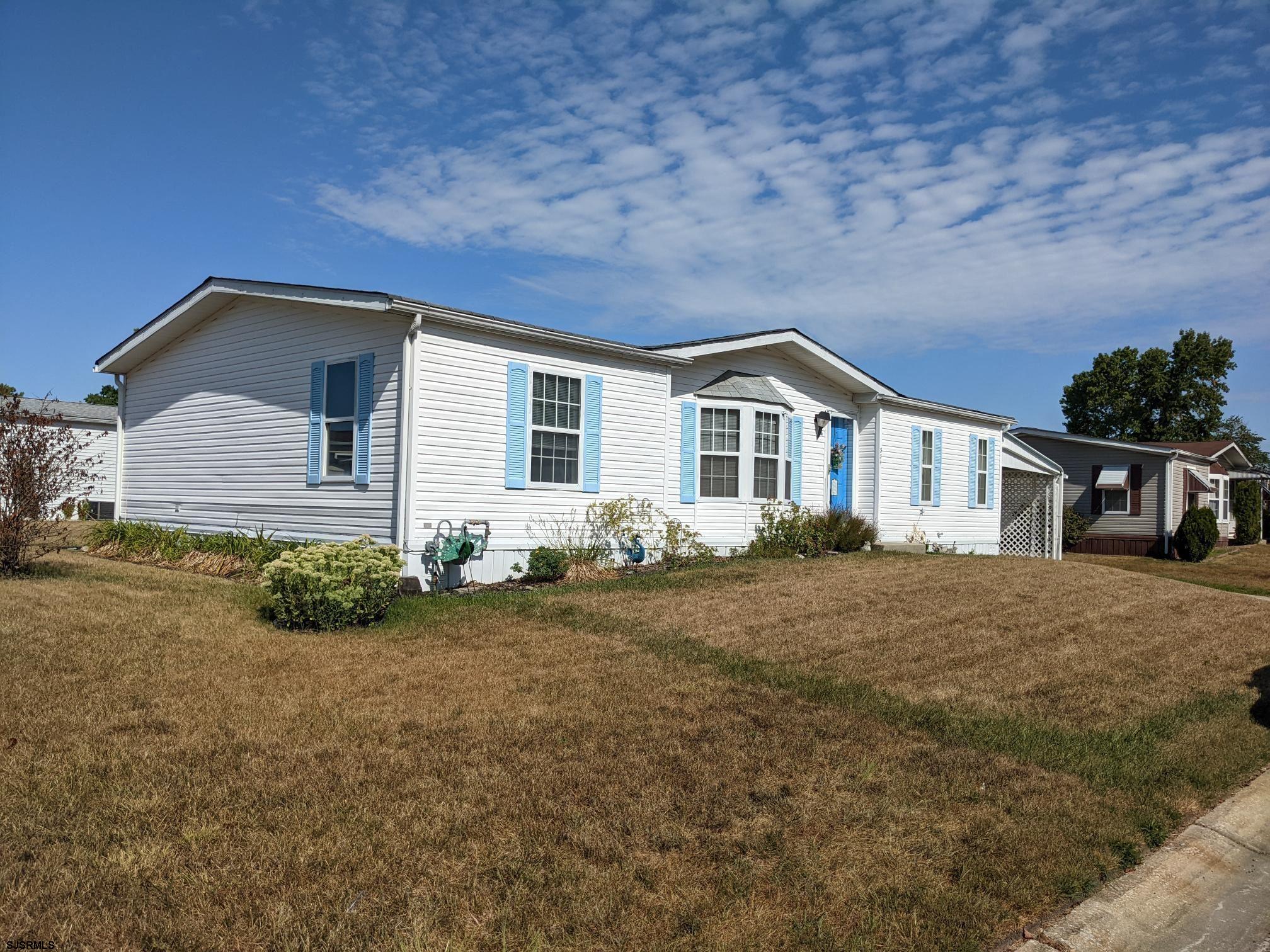 334 John Alden Drive Buena, NJ 08310 - Photo 25 of 27 a front view of a house with a yard