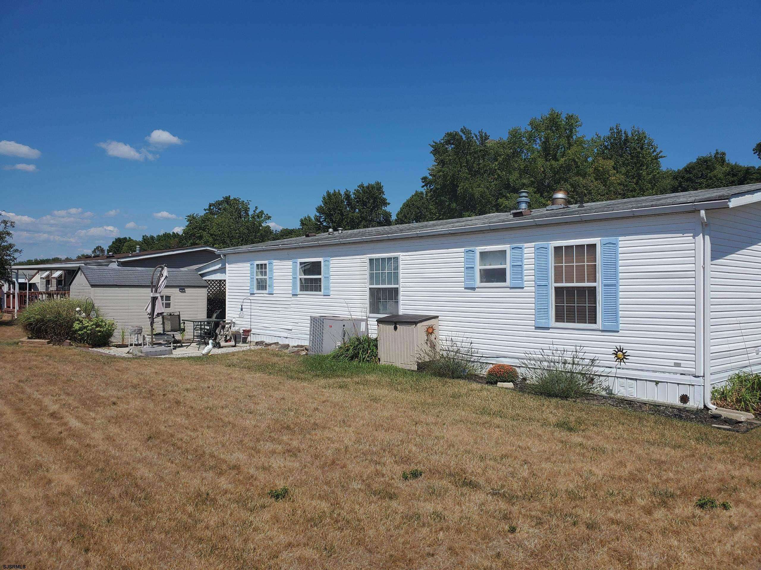 334 John Alden Drive Buena, NJ 08310 - Photo 27 of 27 a view of a house with backyard and sitting area