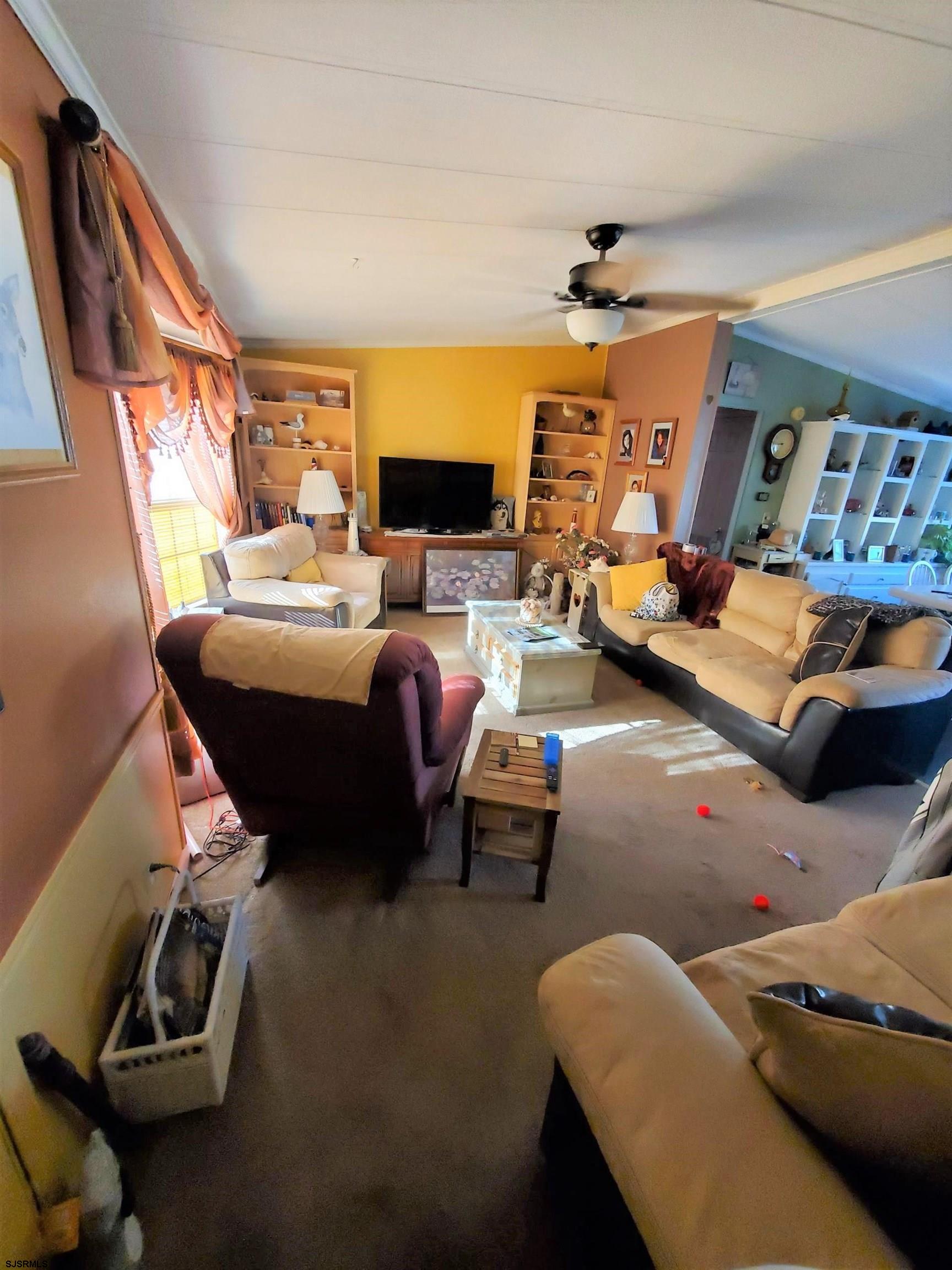 334 John Alden Drive Buena, NJ 08310 - Photo 3 of 27 a living room with furniture a fireplace and a flat screen tv