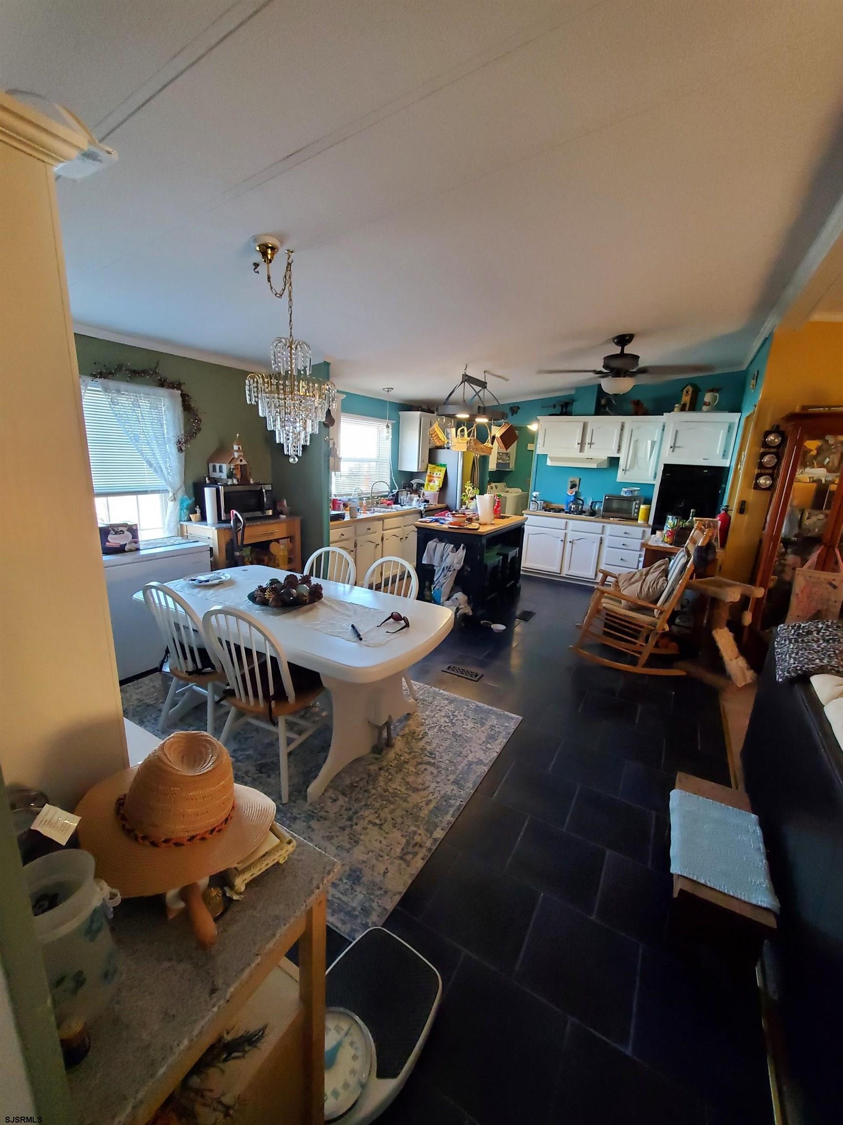 334 John Alden Drive Buena, NJ 08310 - Photo 5 of 27 a living room with furniture a rug and a chandelier