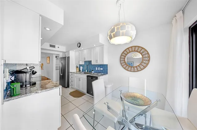 a kitchen with a dining table and chairs