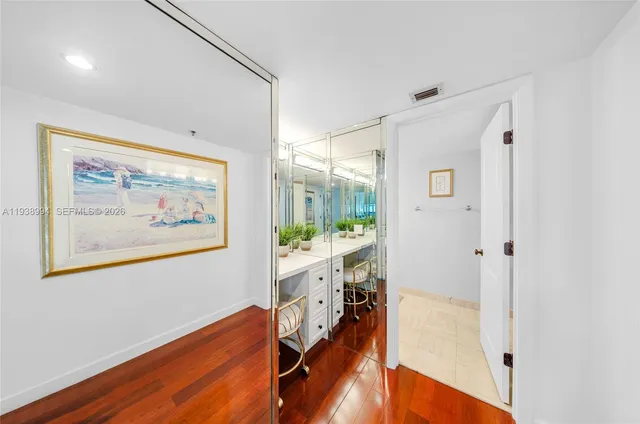 a view of a room with wooden floor and window
