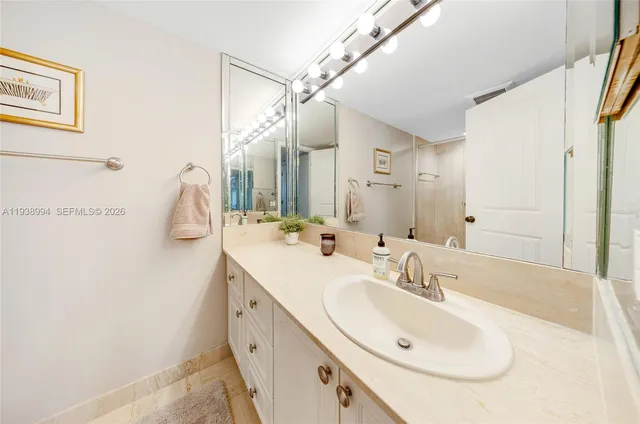 a bathroom with a double vanity sink and mirror