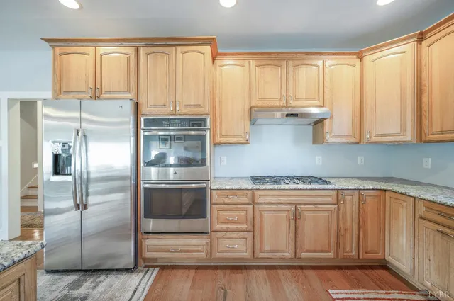 a balcony with table and chairs