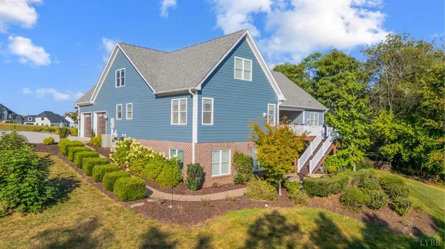 a kitchen with granite countertop kitchen island stainless steel appliances a table and chairs