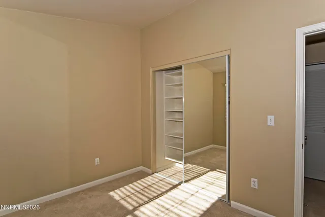 a room that has a bed and a window