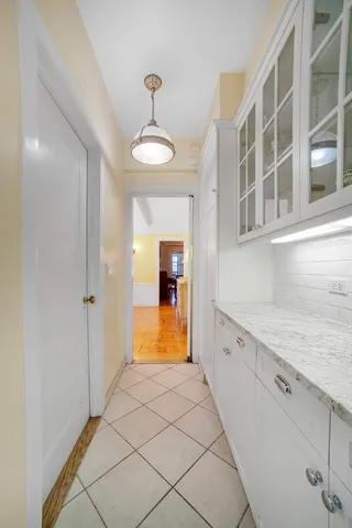 a view of a bedroom with workspace and a window