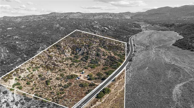 a view of a large building with a mountain