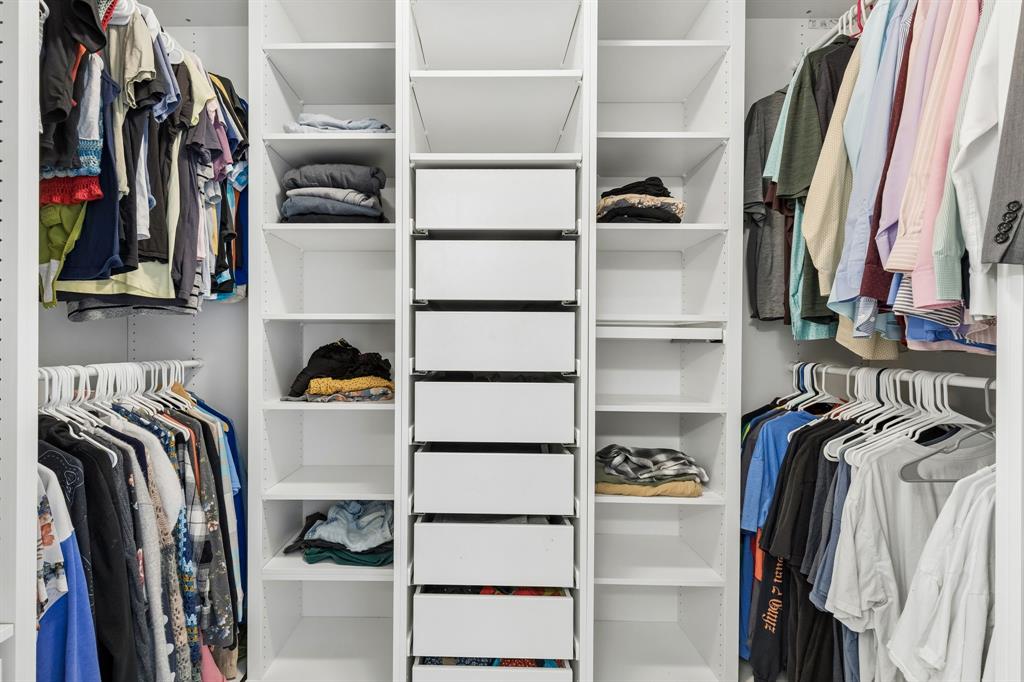 304 Lark Lane Euless, TX 76039 - Photo 21 of 32 a view of walk in closet with clothes and shoes