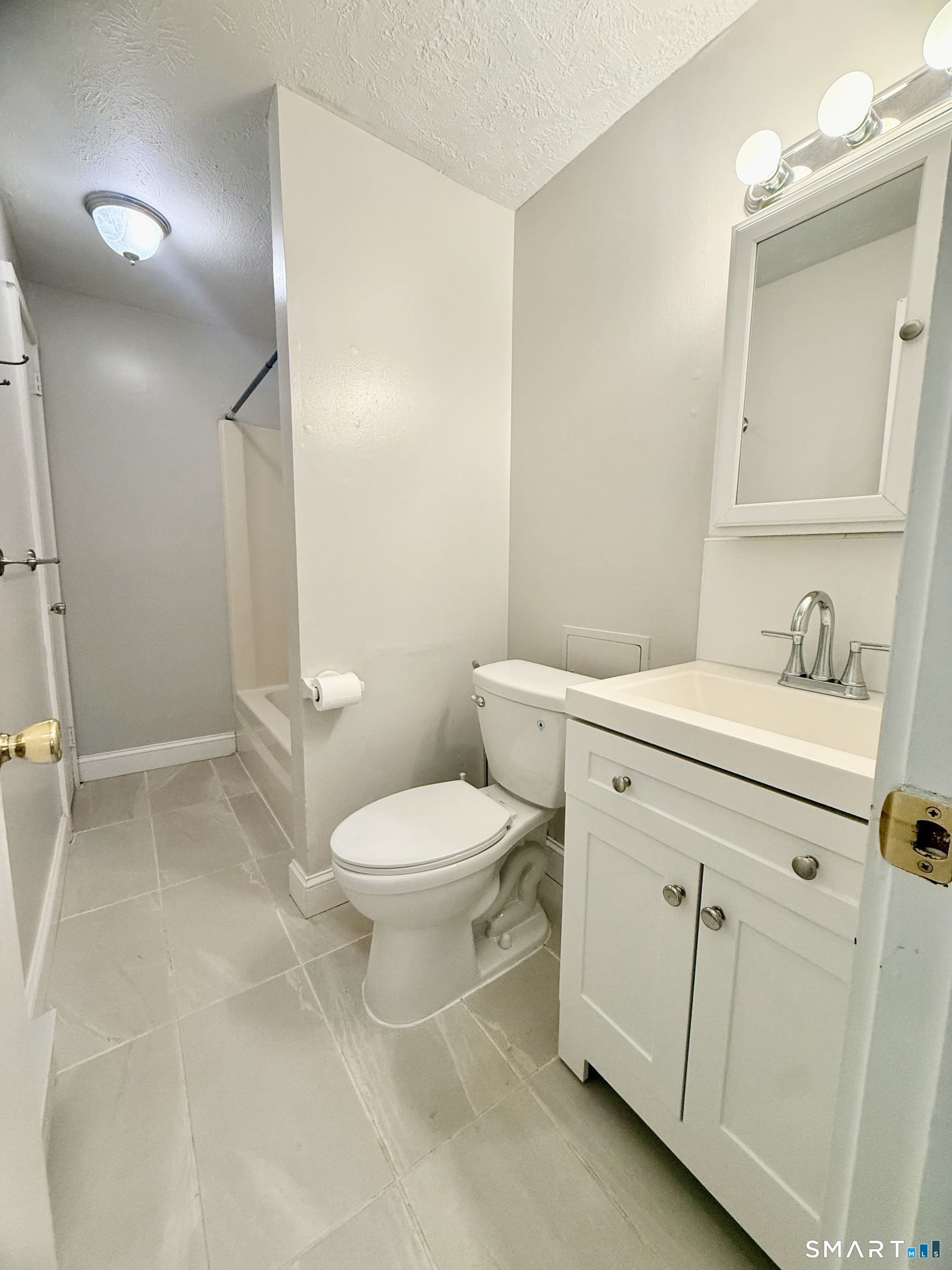 801 Pleasant Valley Road, Unit 801 South Windsor, CT 06074 - Photo 11 of 12 a bathroom with a toilet sink and a mirror