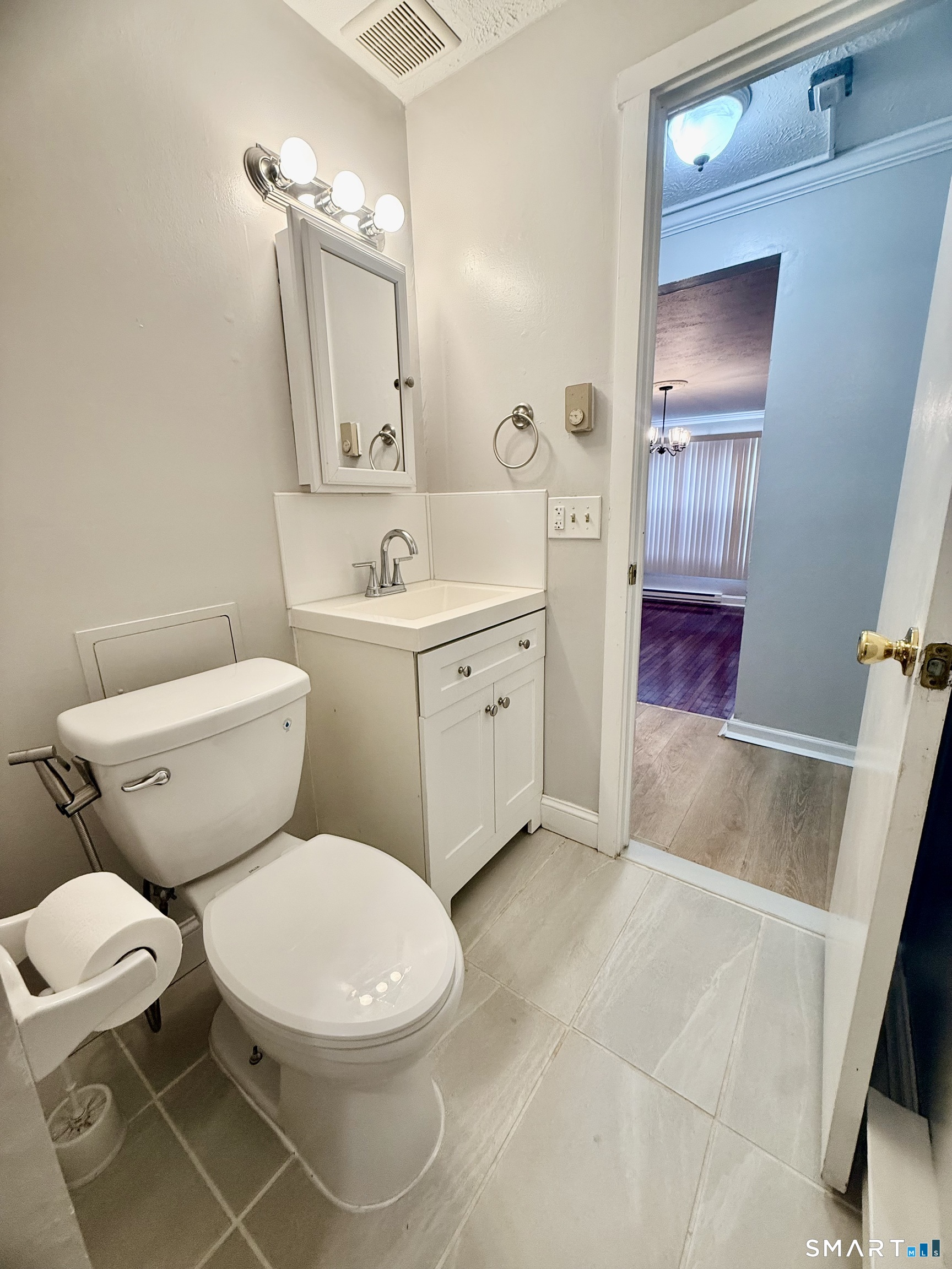 801 Pleasant Valley Road, Unit 801 South Windsor, CT 06074 - Photo 12 of 12 a white toilet sitting next to a bathroom sink