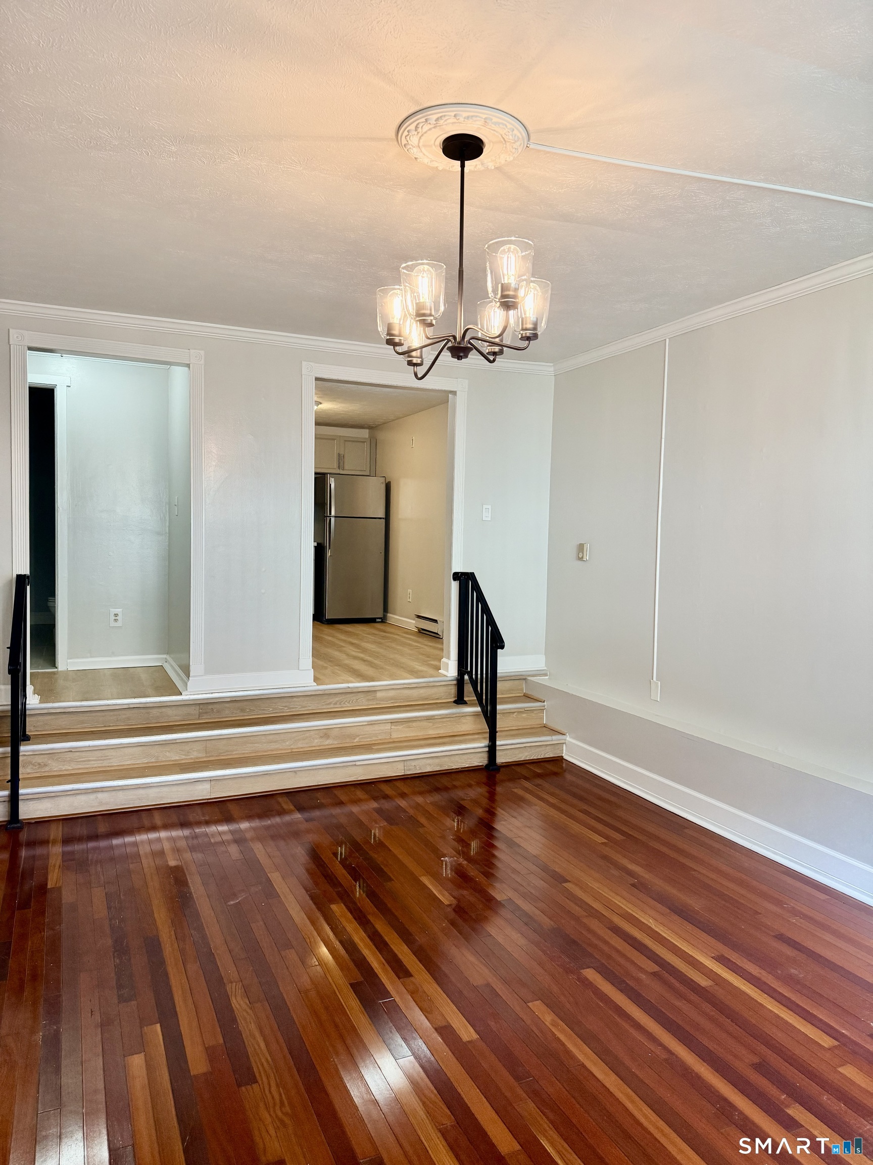 801 Pleasant Valley Road, Unit 801 South Windsor, CT 06074 - Photo 8 of 12 a view of an empty room with wooden floor and a window