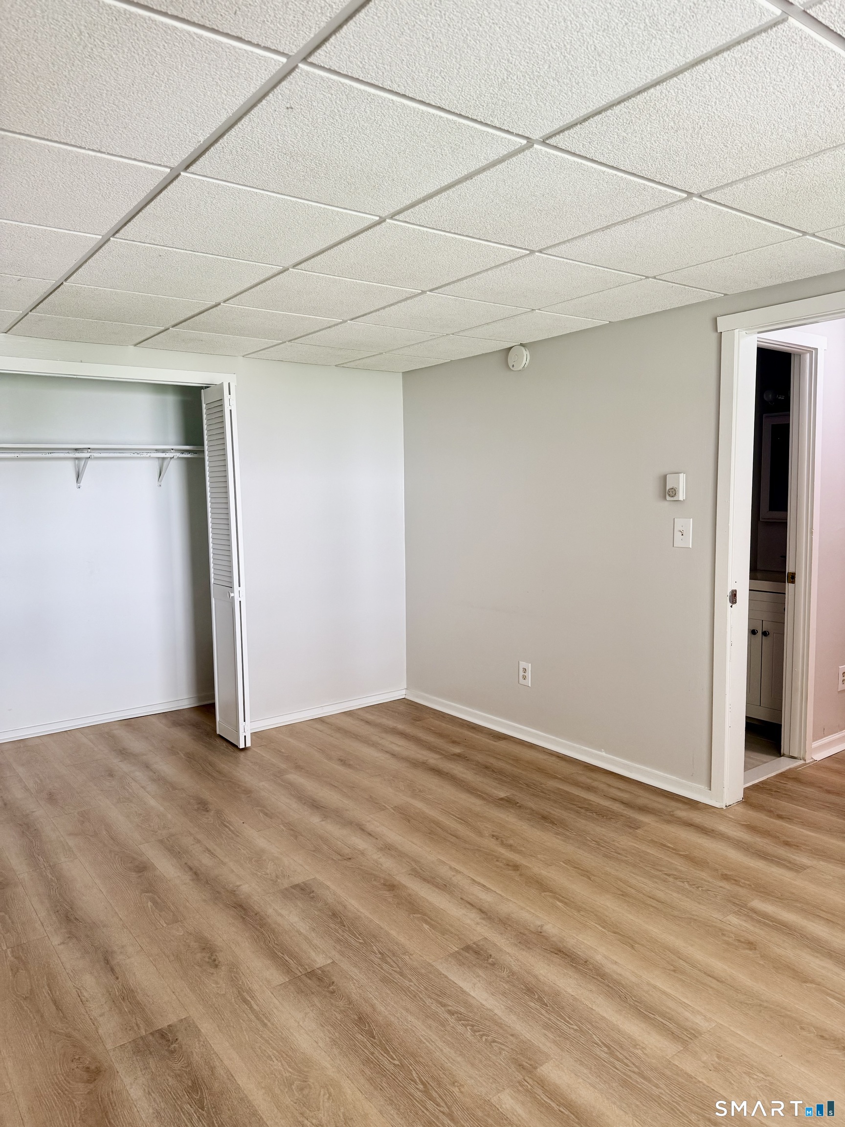 801 Pleasant Valley Road, Unit 801 South Windsor, CT 06074 - Photo 9 of 12 a view of empty room with wooden floor