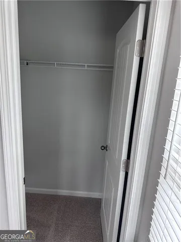 a bathroom with a granite countertop sink mirror and a bathtub