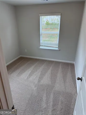 a view of a room with a large window