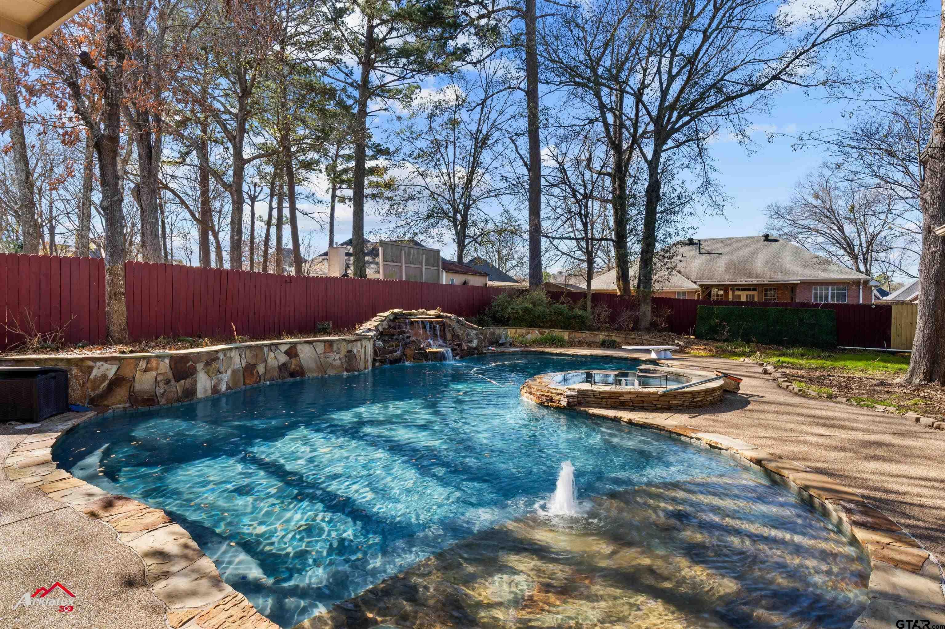 3815 Holly Ridge Drive Longview, TX 75605 - Photo 22 of 22 a view of swimming pool with lawn chairs and wooden fence
