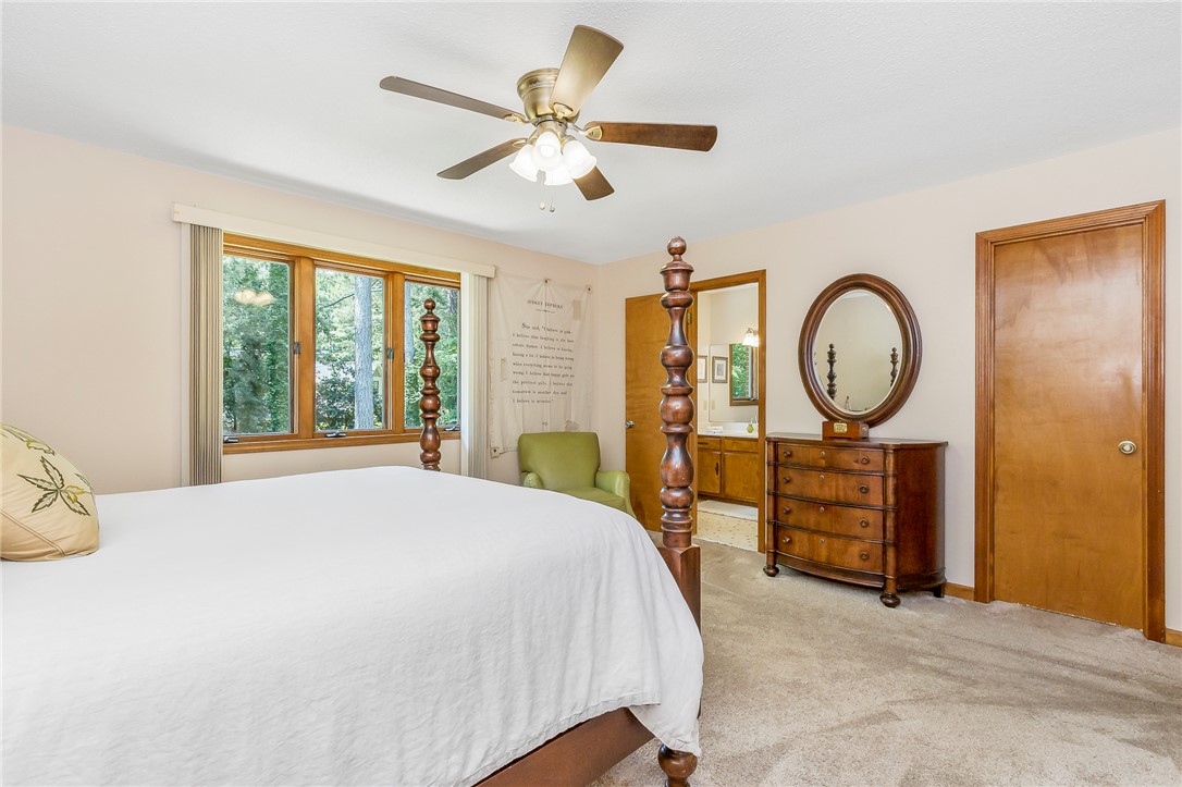 207 Laurel Ridge Road Anderson, SC 29621 - Photo 37 of 50 A tranquil bedroom retreat features a ceiling fan, plush carpet, and a private en-suite bathroom access.