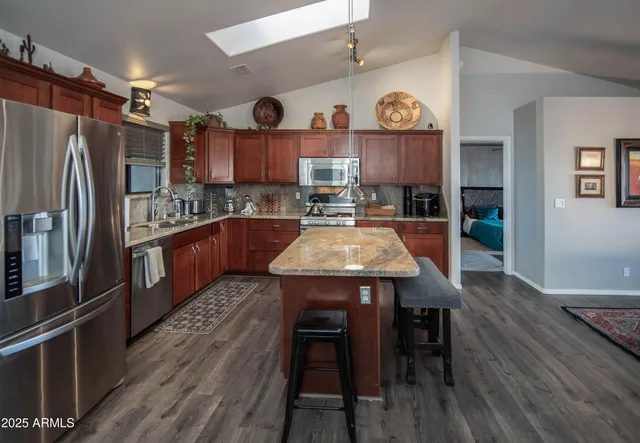 a living room with furniture a dining table and chairs