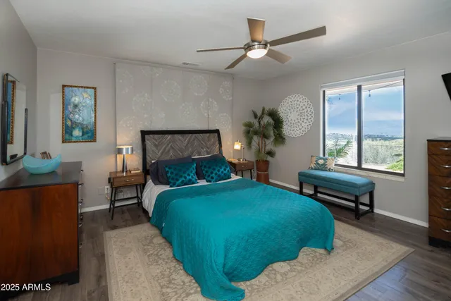 a living room with a bed furniture and a window