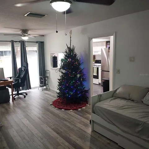 a bedroom with a bed and a mirror