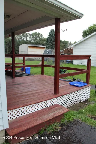 a front view of house with a garden and patio