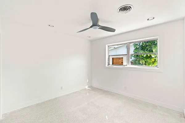 a view of an empty room with a window