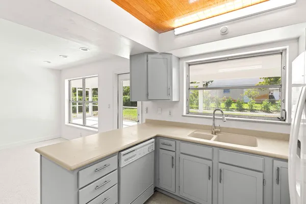 a kitchen with a sink and cabinets