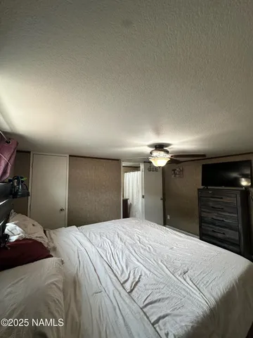 a bedroom with a bed and a walk in closet