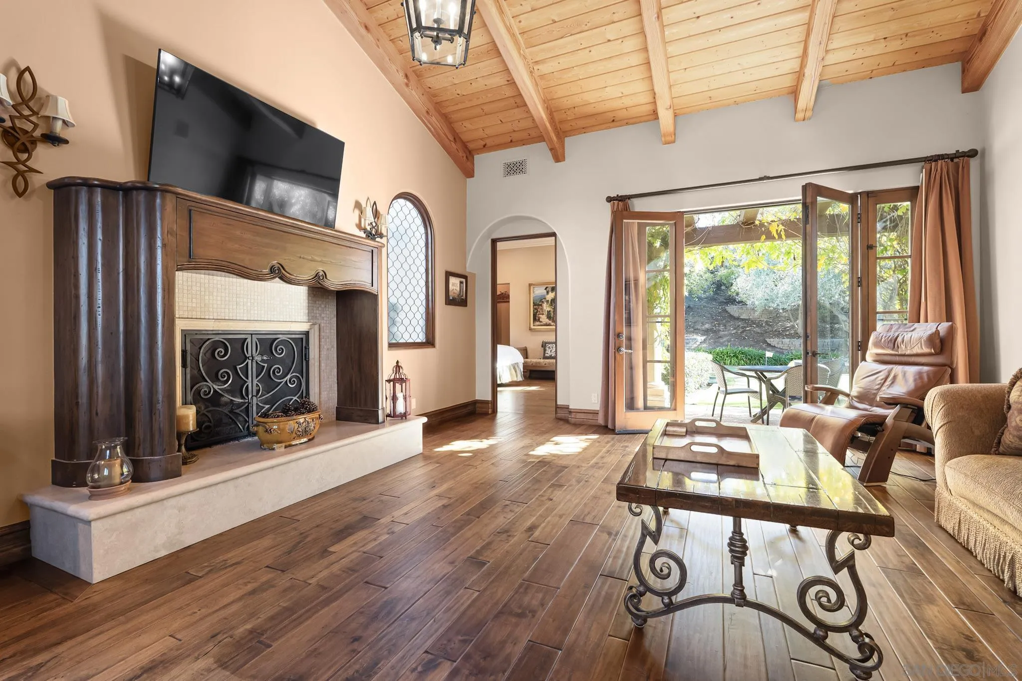 18486 Via Candela Rancho Santa Fe, CA 92091 - Photo 21 of 34 a living room with furniture a flat screen tv and a large window