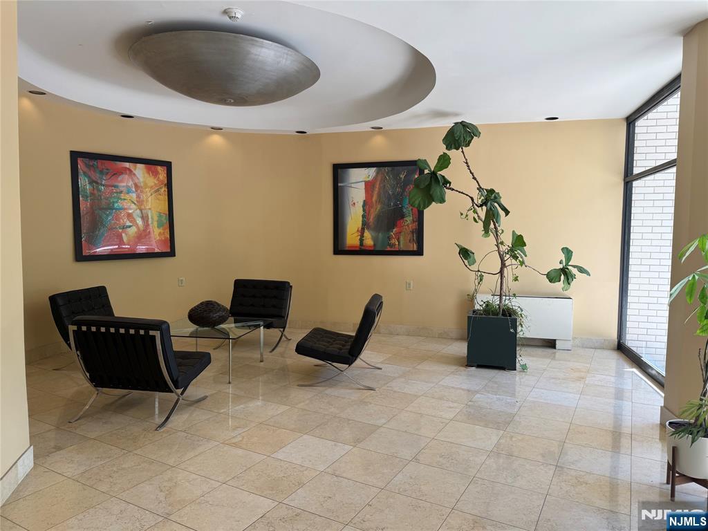 1375 River Road, Unit 1K Edgewater, NJ 07020 - Photo 14 of 15 a living room with furniture