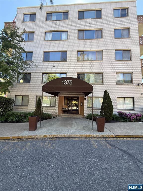 1375 River Road, Unit 1K Edgewater, NJ 07020 - Photo 3 of 15 a house view with a outdoor space
