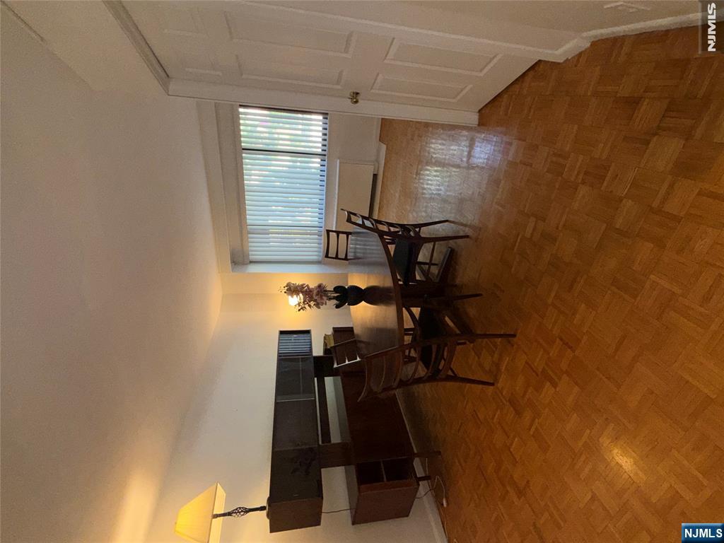 1375 River Road, Unit 1K Edgewater, NJ 07020 - Photo 6 of 15 a view of a livingroom with furniture and window