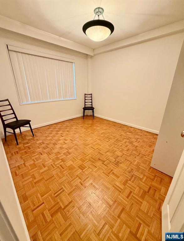 1375 River Road, Unit 1K Edgewater, NJ 07020 - Photo 7 of 15 a view of a room with wooden floor and a carpet