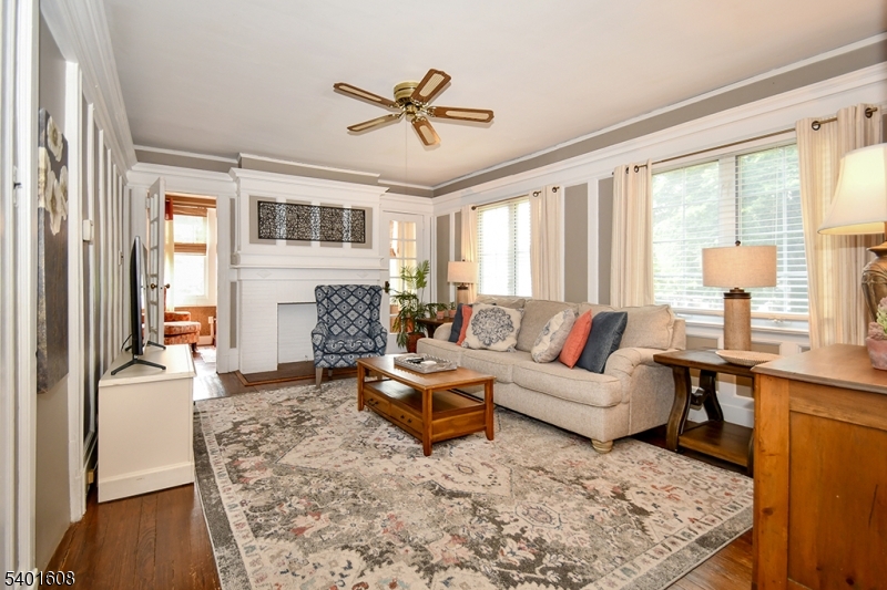 123 Baker Street Maplewood, NJ 07040 - Photo 2 of 10 a living room with furniture and a large window