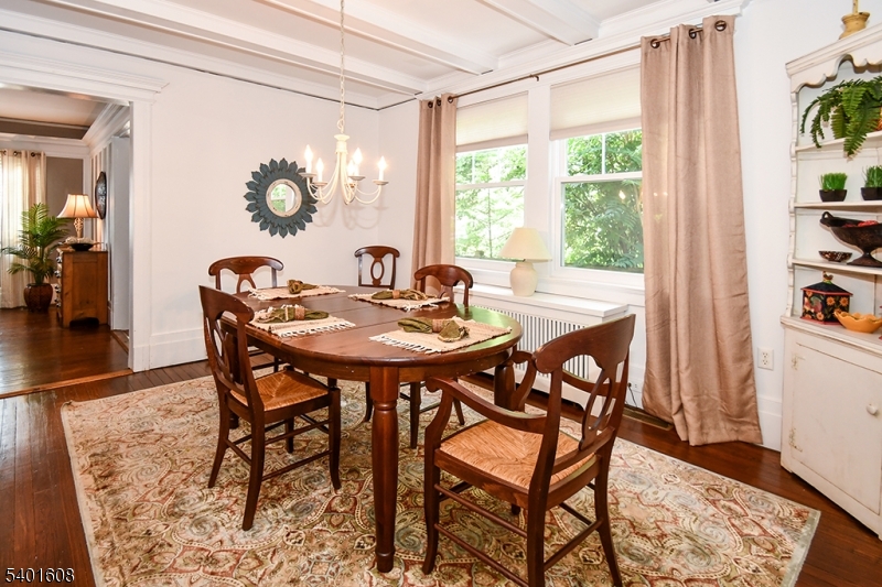 123 Baker Street Maplewood, NJ 07040 - Photo 4 of 10 a view of a dining room with furniture and chandelier