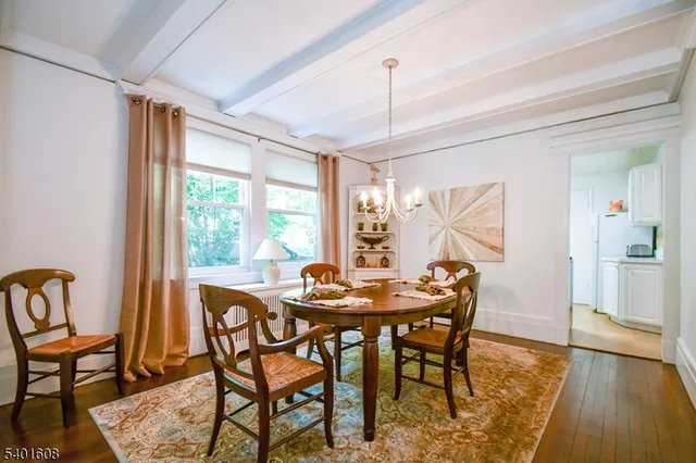a dining room with furniture window wooden floor