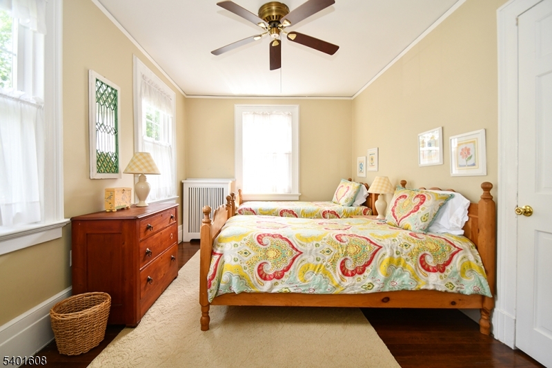 123 Baker Street Maplewood, NJ 07040 - Photo 9 of 10 a bedroom with a bed and window